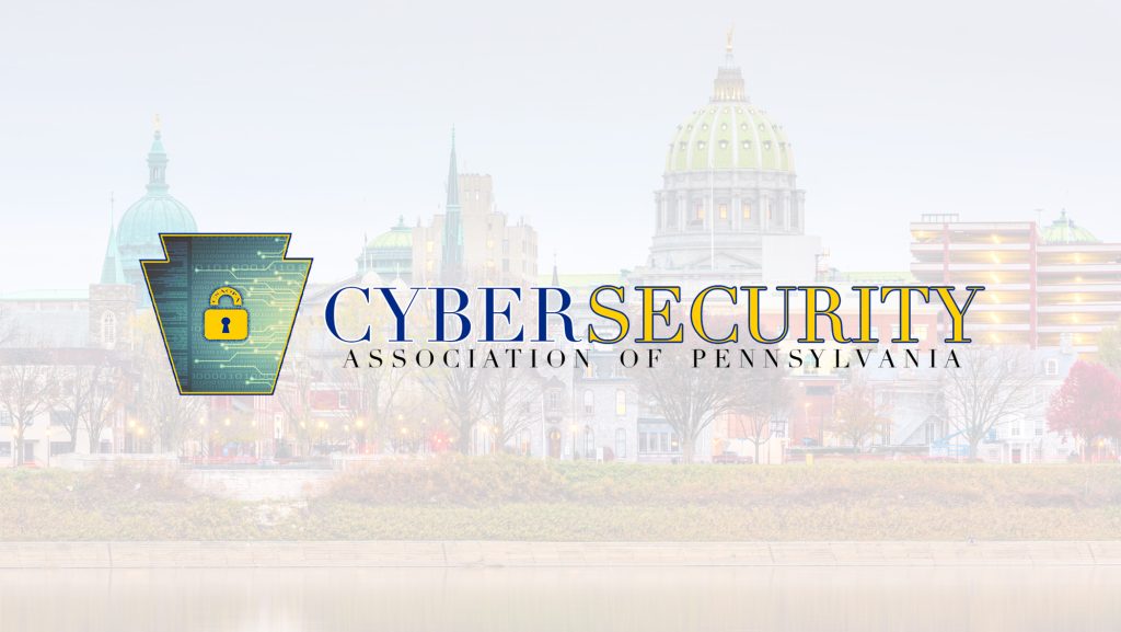 Logo for the Cybersecurity Association of Pennsylvania, featuring a keystone shape with a padlock icon symbolizing cyber security, overlaid on a cityscape with a domed building in the background.