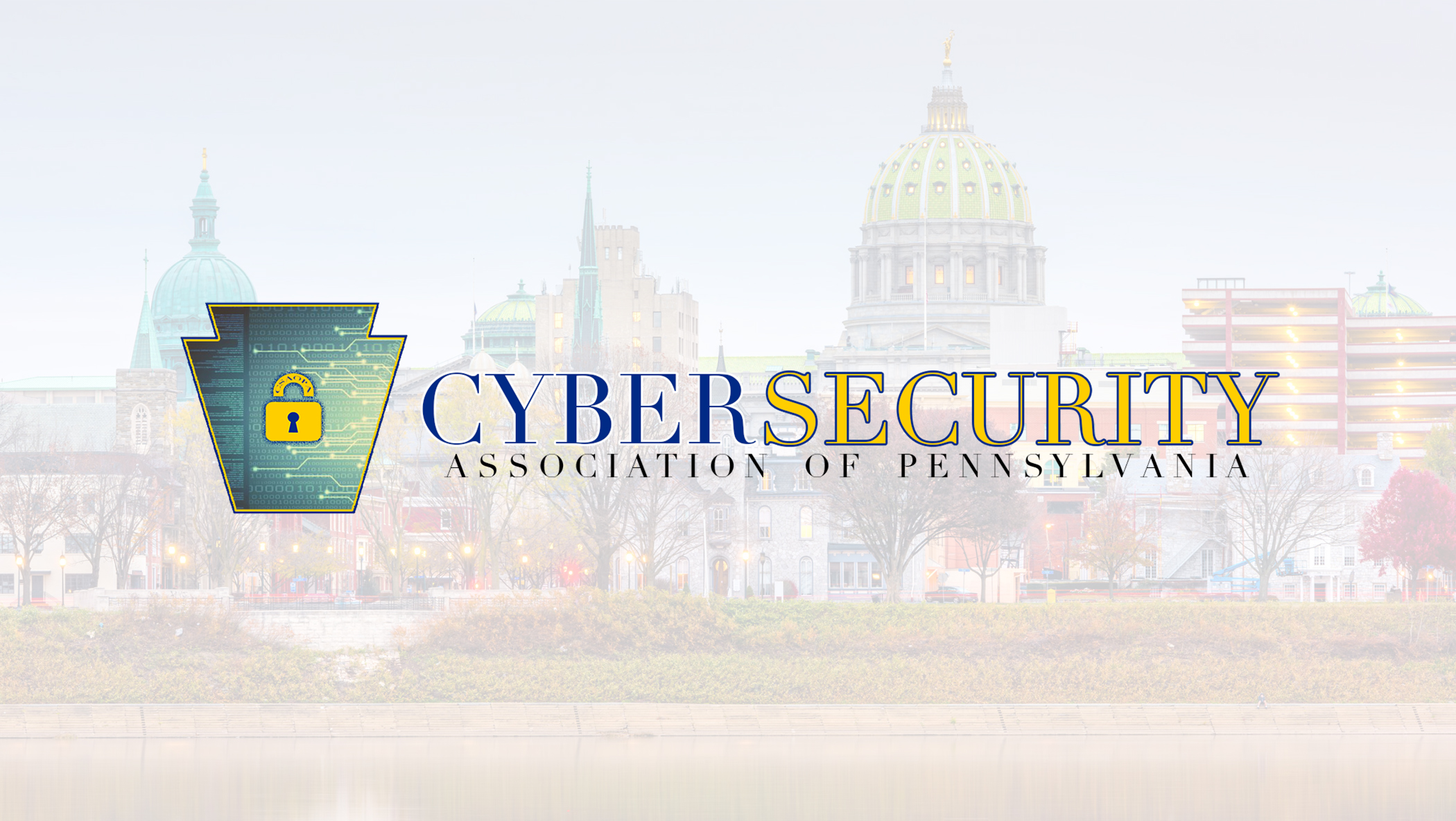 Logo for the Cybersecurity Association of Pennsylvania, featuring a keystone shape with a padlock icon symbolizing cyber security, overlaid on a cityscape with a domed building in the background.